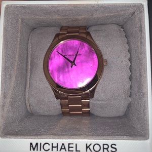 Michael Kors pink face watch.